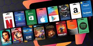 An assortment of digital gift cards displayed on a colorful background, featuring popular brands like Netflix, PlayStation Store, Xbox, App Store & iTunes, Google Play, Amazon, Facebook, Spotify, Nintendo, League of Legends, Roblox, and more.